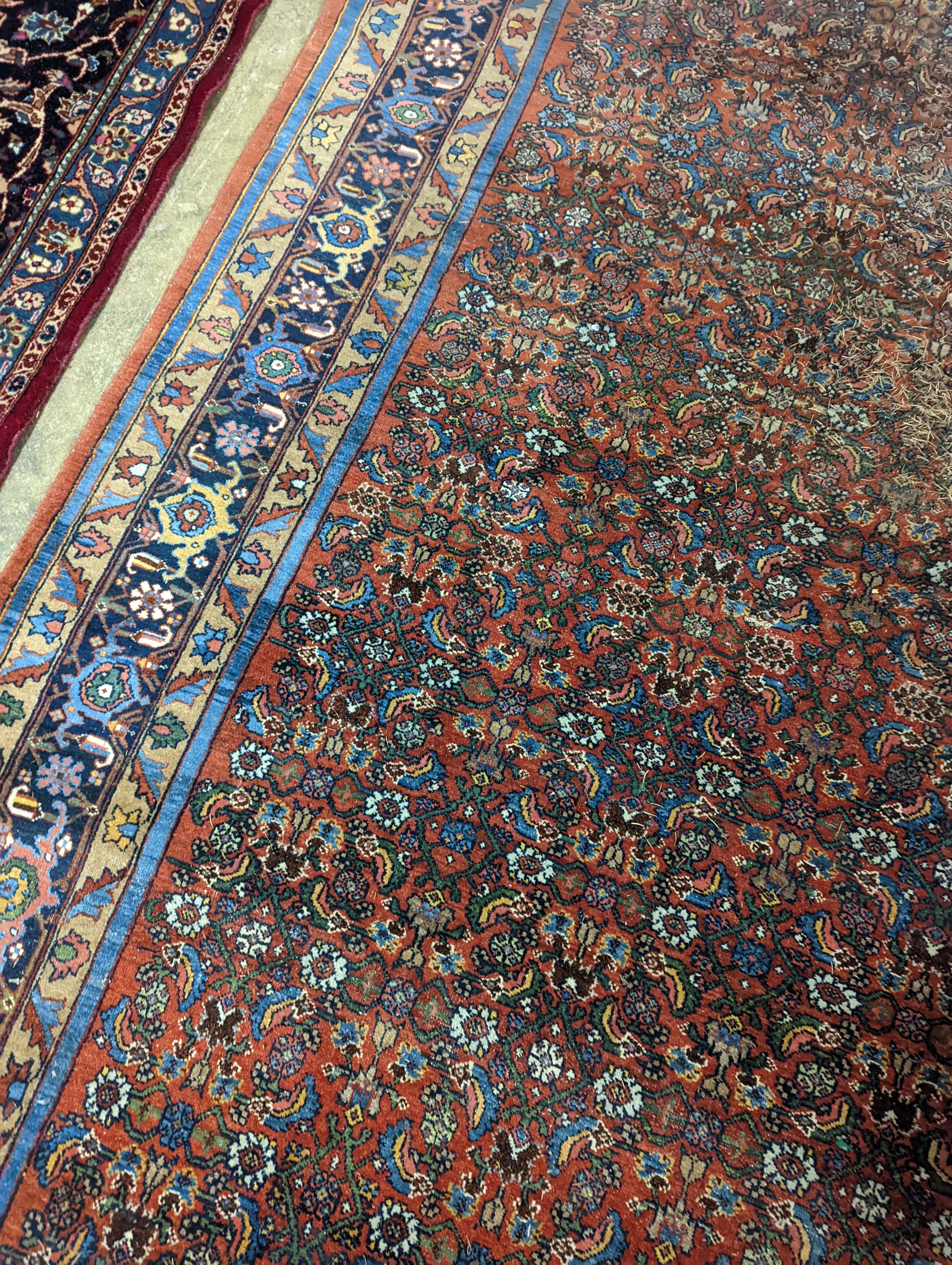 A North West Persian red ground carpet, 360 x 250cm